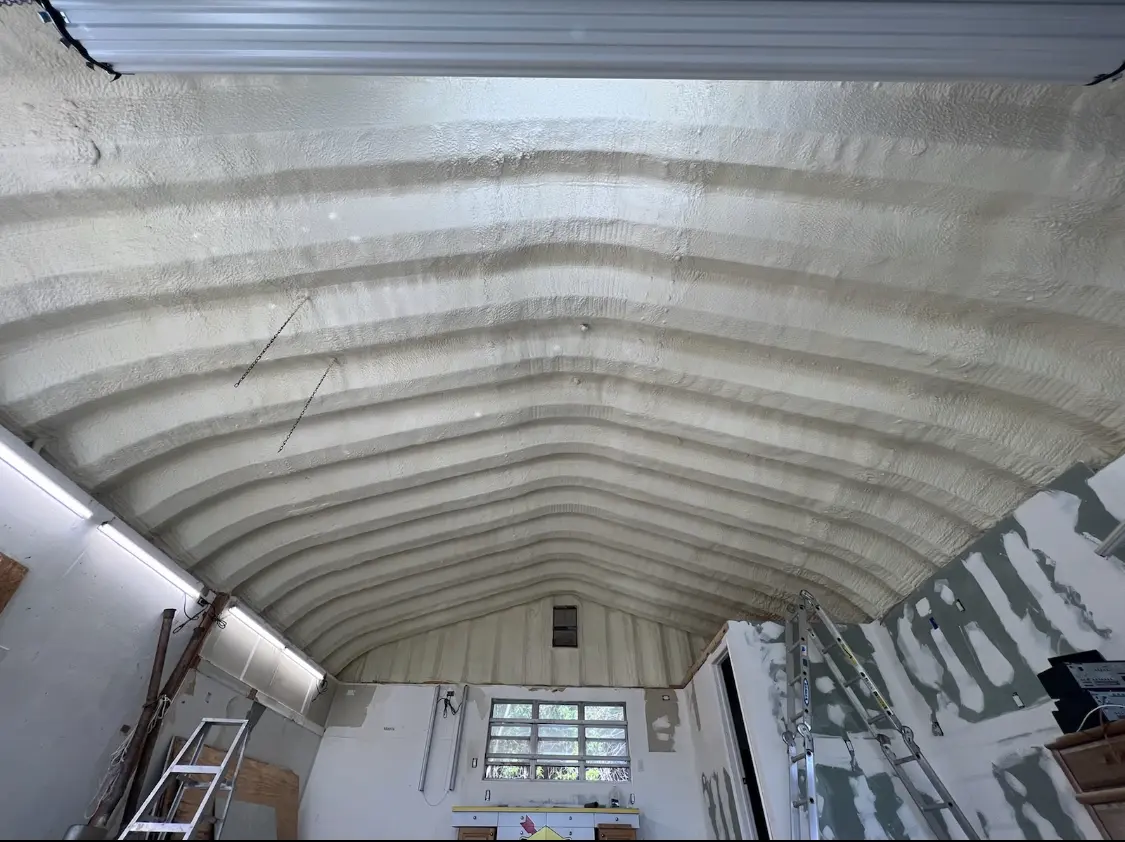 Spray polyurethane foam applied to the underside of a metal roof deck in Storm Lake