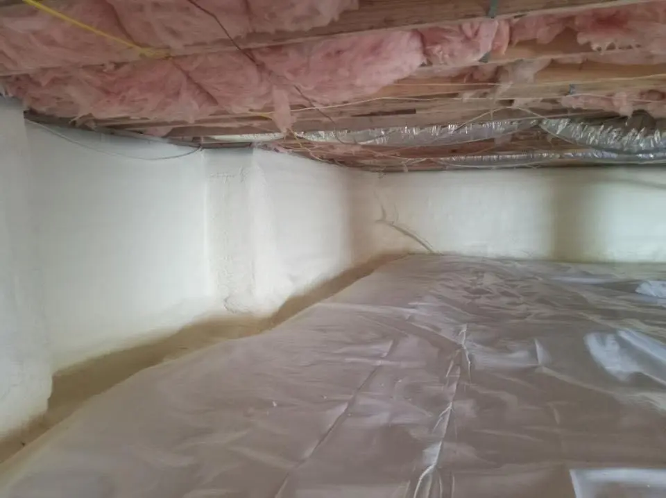 Crawl space encapsulation with closed-cell spray foam for Commercial Roof Restoration in Storm Lake
